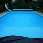 Swimming pool with slide